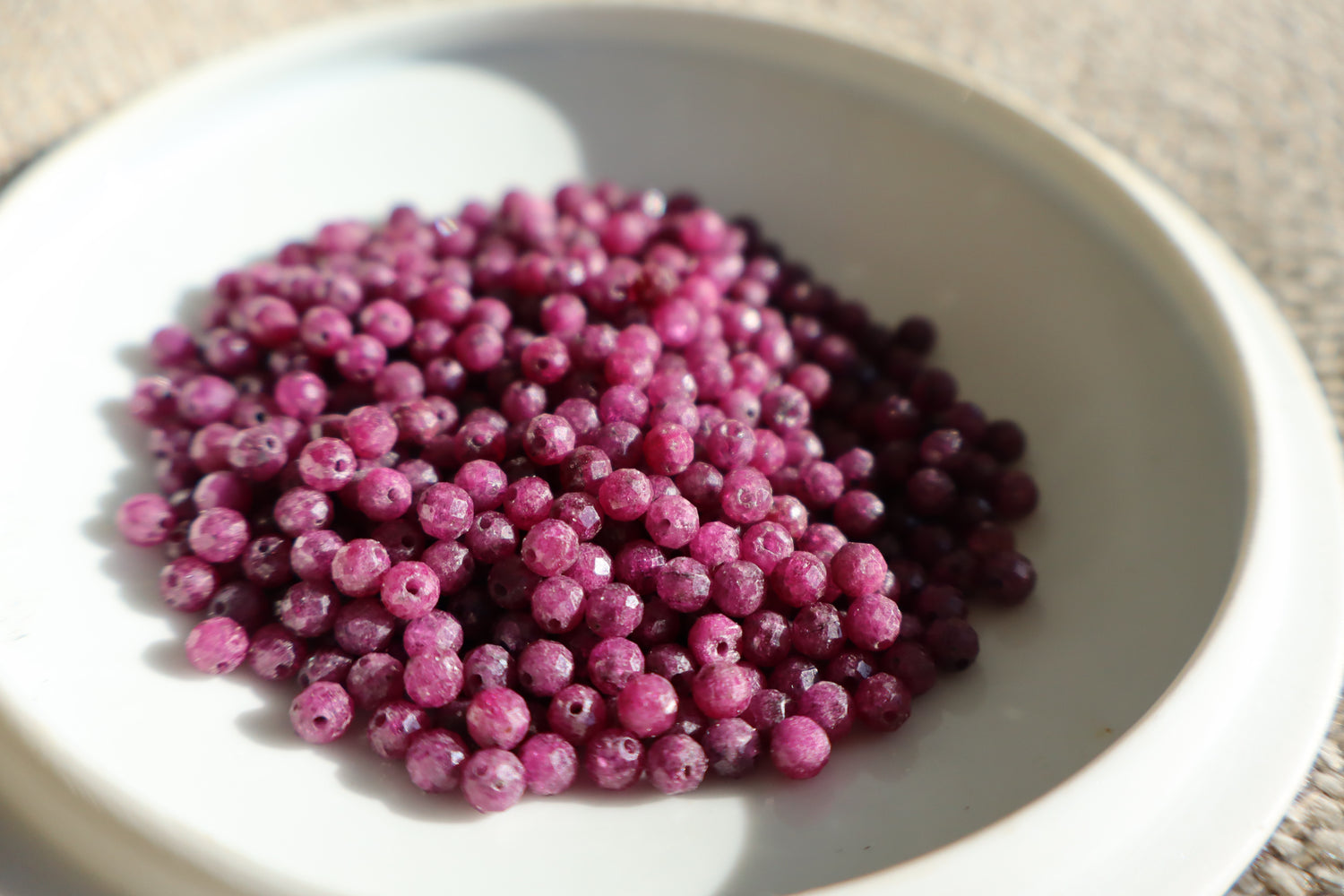 Purple beads in a bowl